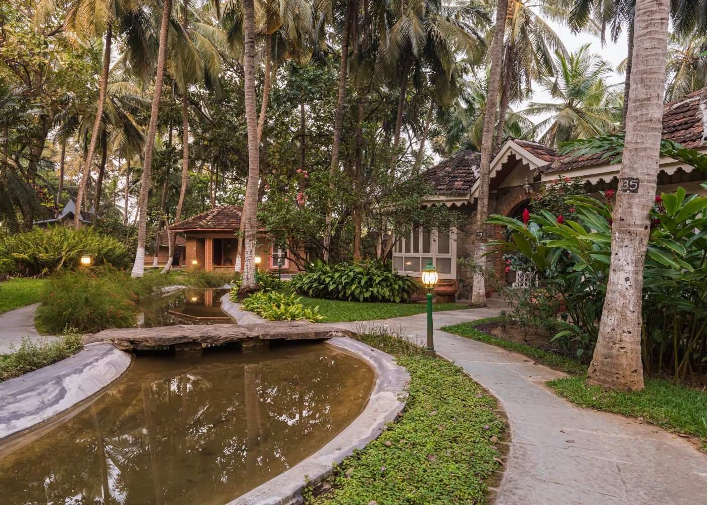 Traditional Kerala Garden Cottages Surrounded By Foliage