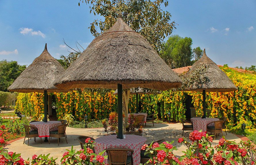 Open-Air Dining Pavilions Surrounded By Flowering Gardens